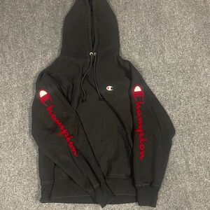 Champion Reverse Weave Black Hoodie with Red Sleeve Logo